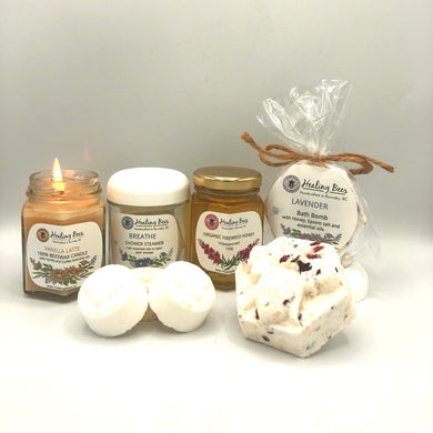 scented candle with shower steamer and bath bombs paired with our local organic honey is a sure win for everyone's gift list