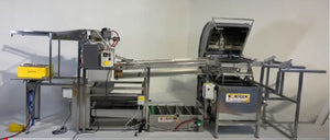 Starting from the left, the picture shows the pneumatic deboxer, automated uncapper, horizontal extractor and out-feed table on the right.  The cappings press fits under the uncapper.  Honey sump collects honey from cappings press and extractor with pump outlet in the middle.  Picture does not show the pneumatic frame pusher and the honey pump.  